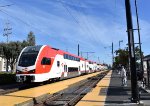 Mid afternoon northbound about to pick up passengers from Broadway Station